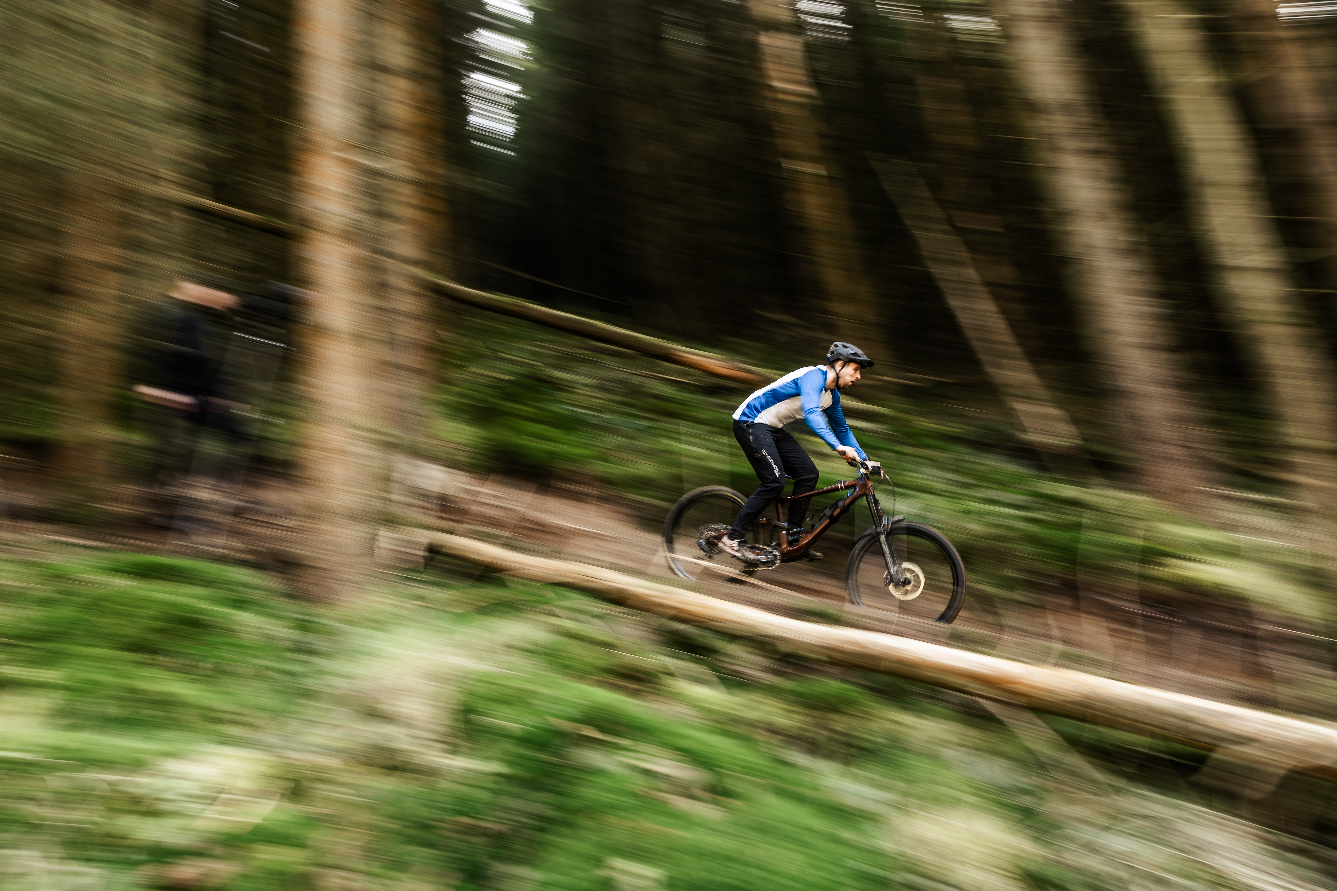 Rider going down a hill fast on their bike