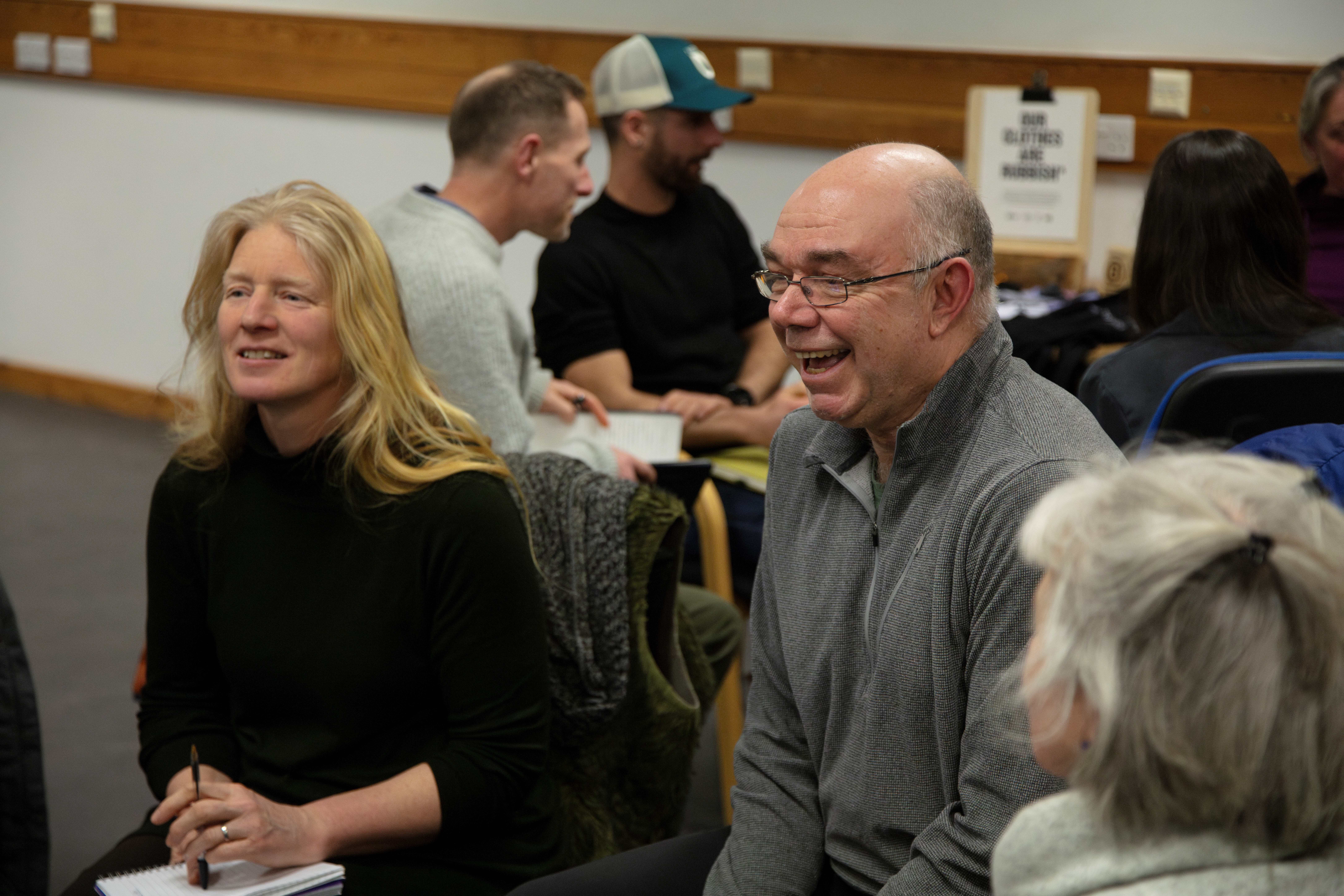 Close of two people smiling 