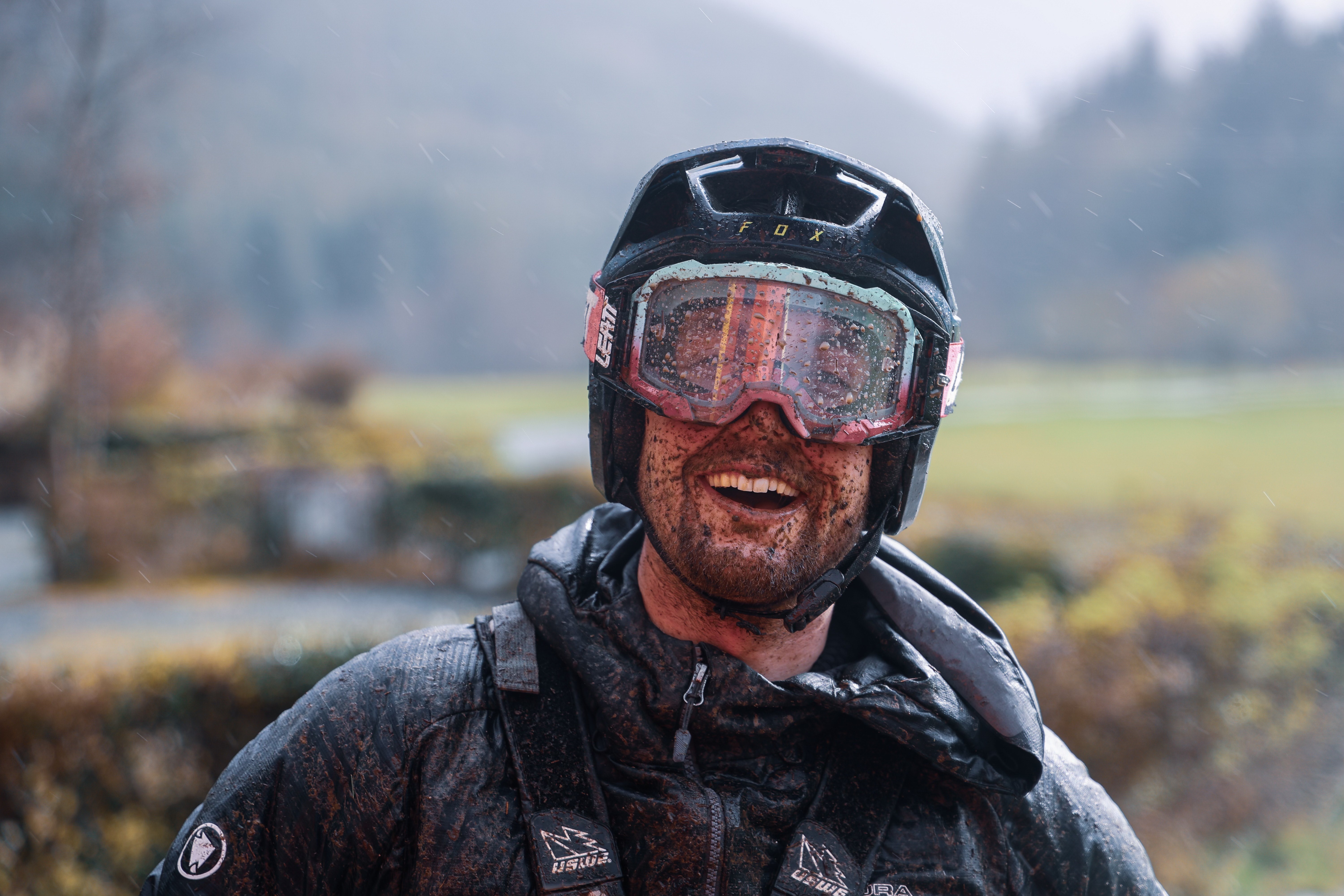 Alex Watkins with mud all over his face post a muddy bike ride