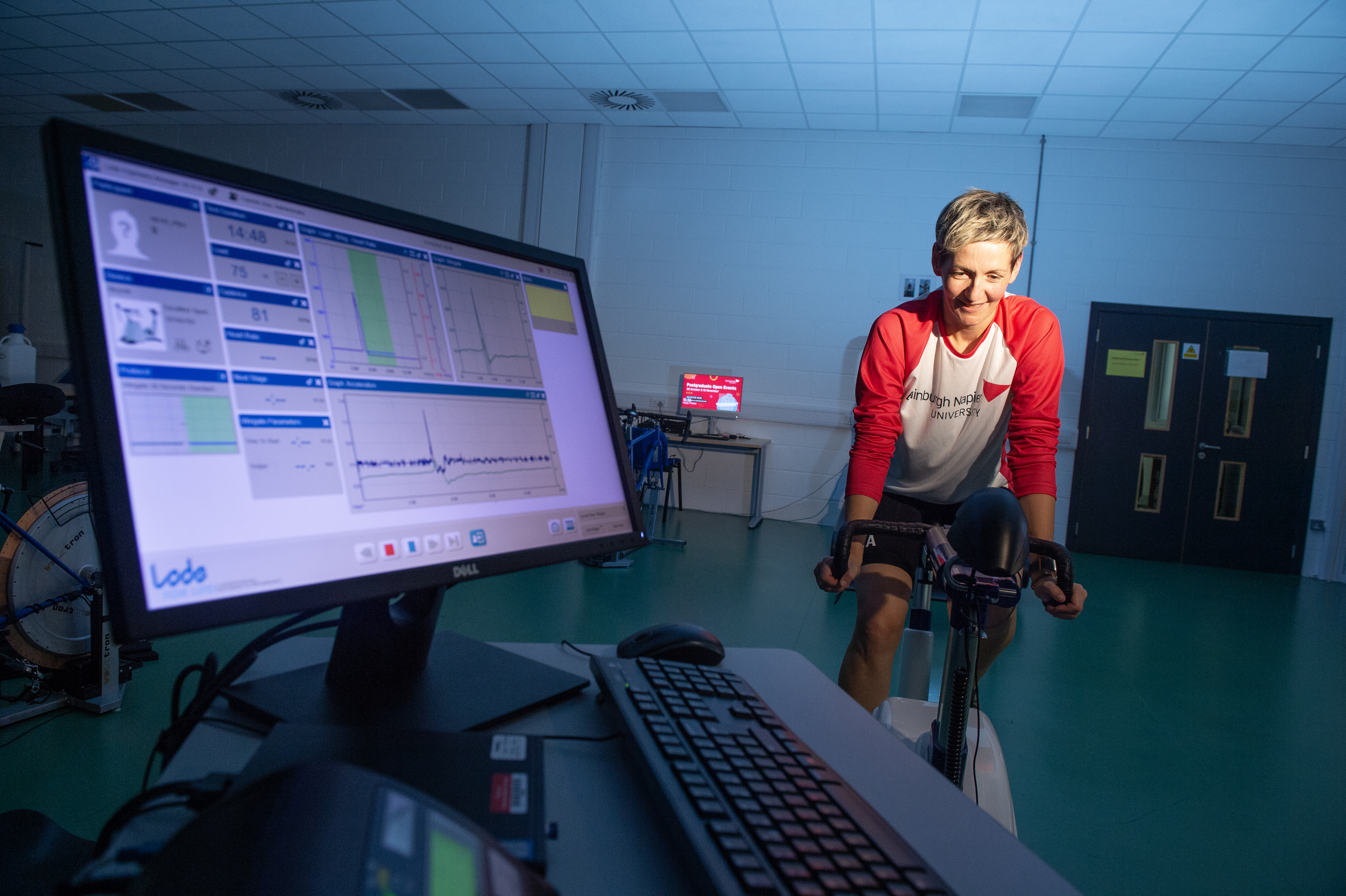 Person riding a stationary bike indoors whilst data is being collected as they ride
