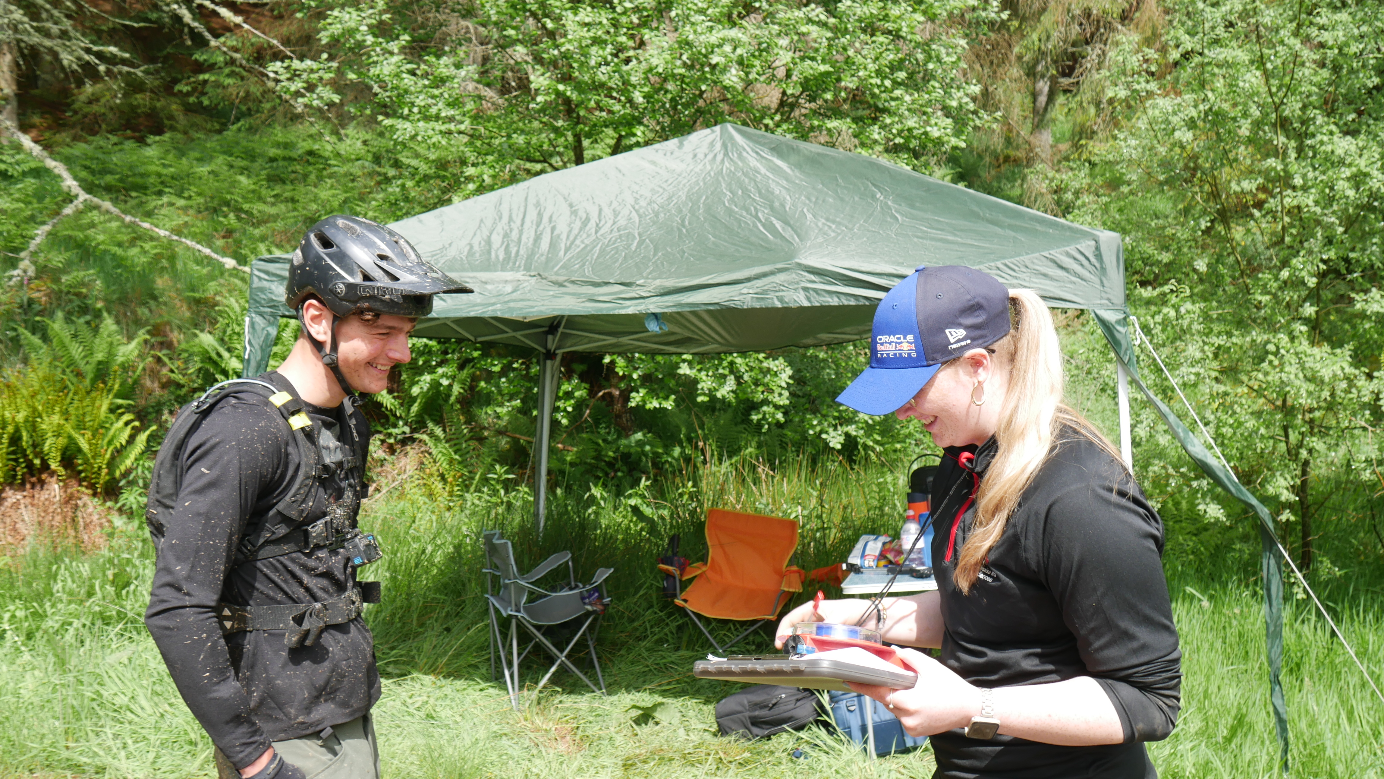Students smiling outside at an event
